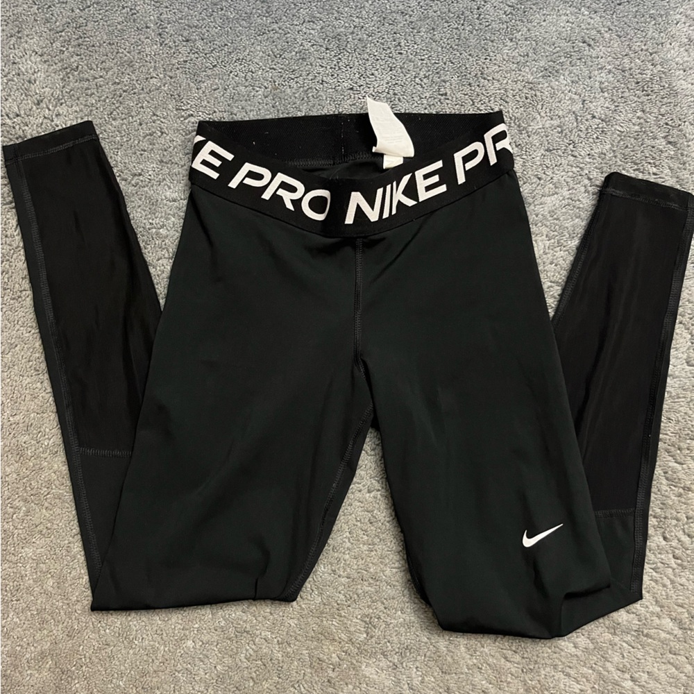 Nike running leggings with mesh detail on the calves